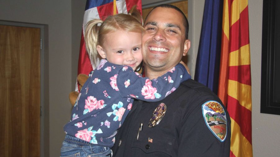 Police officer adopts little girl he comforted