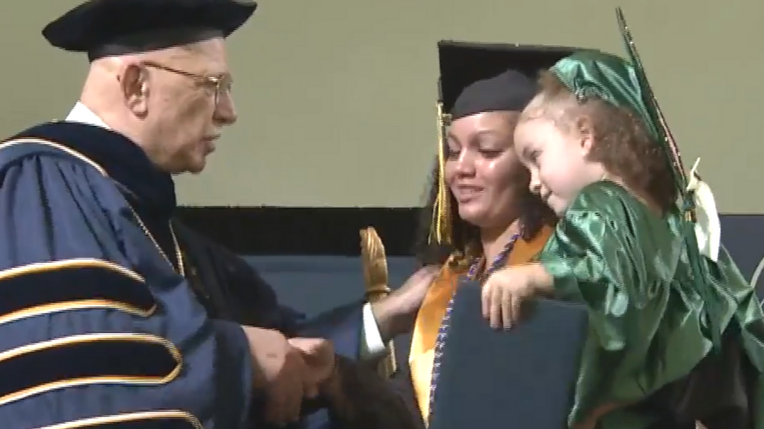Single Mom Graduates College With 2 Year Old Daughter On Arm