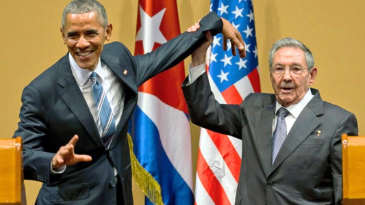 Man grabs Obama's Arm in front of crowd